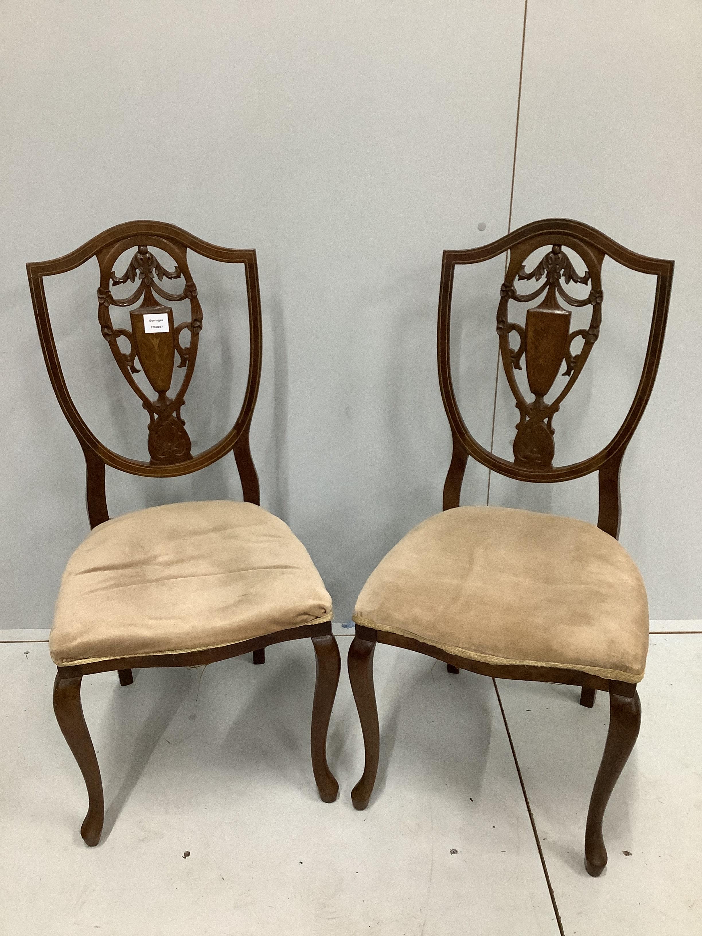 A pair of Edwardian inlaid mahogany shield back side chairs